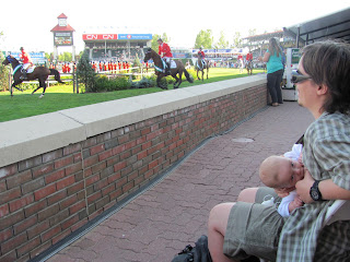 I'm nursing in the audience at a horse show